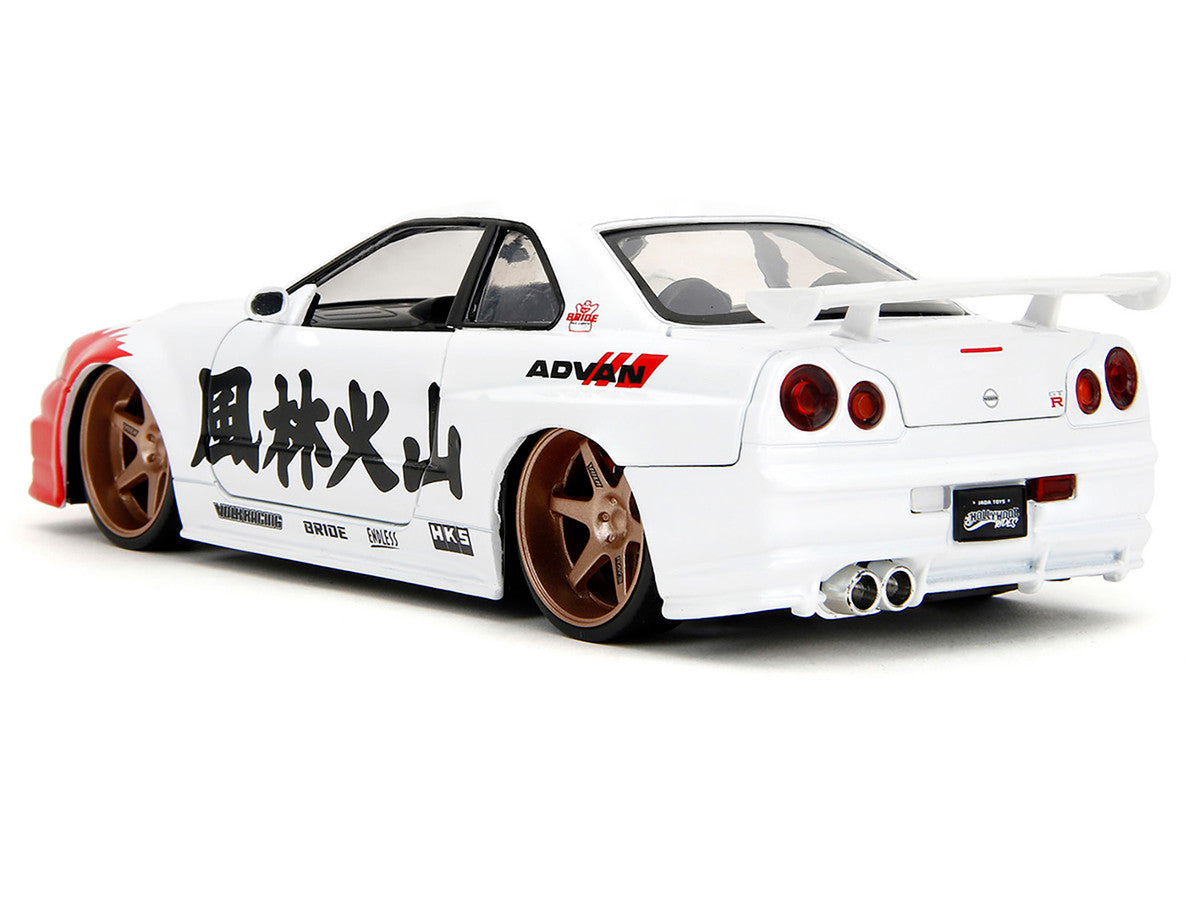 2002 Nissan Skyline GT-R (R34) RHD (Right Hand Drive) White with Red Graphics and Ryu Diecast Figure "Street Fighter" Video Game "Anime Hollywood Rides" Series 1/24 Diecast Model Car by Jada